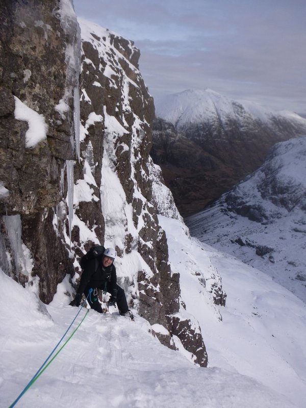 Nick climbing in the sunshine on Eastern Slant during our winter climbing course