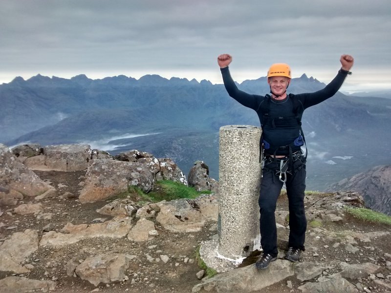 Stu on the summit of Bla Bheinn, having competed a non-stop traverse of the Greater Cuillin Ridge Traverse!