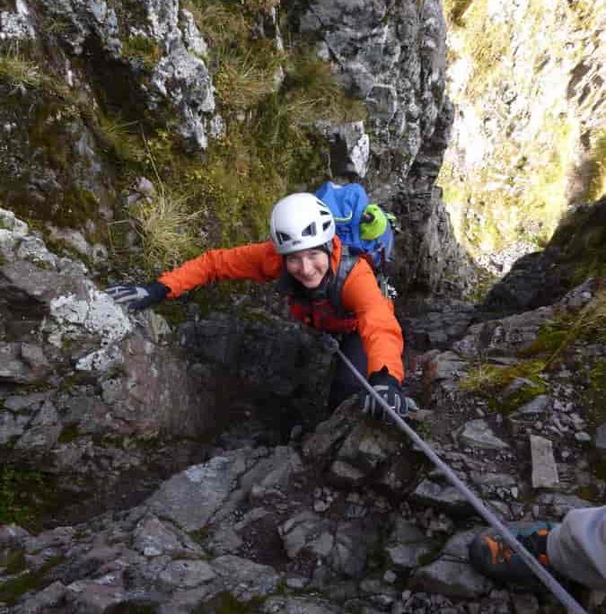 Happy client being guided on the Aonach Eagach